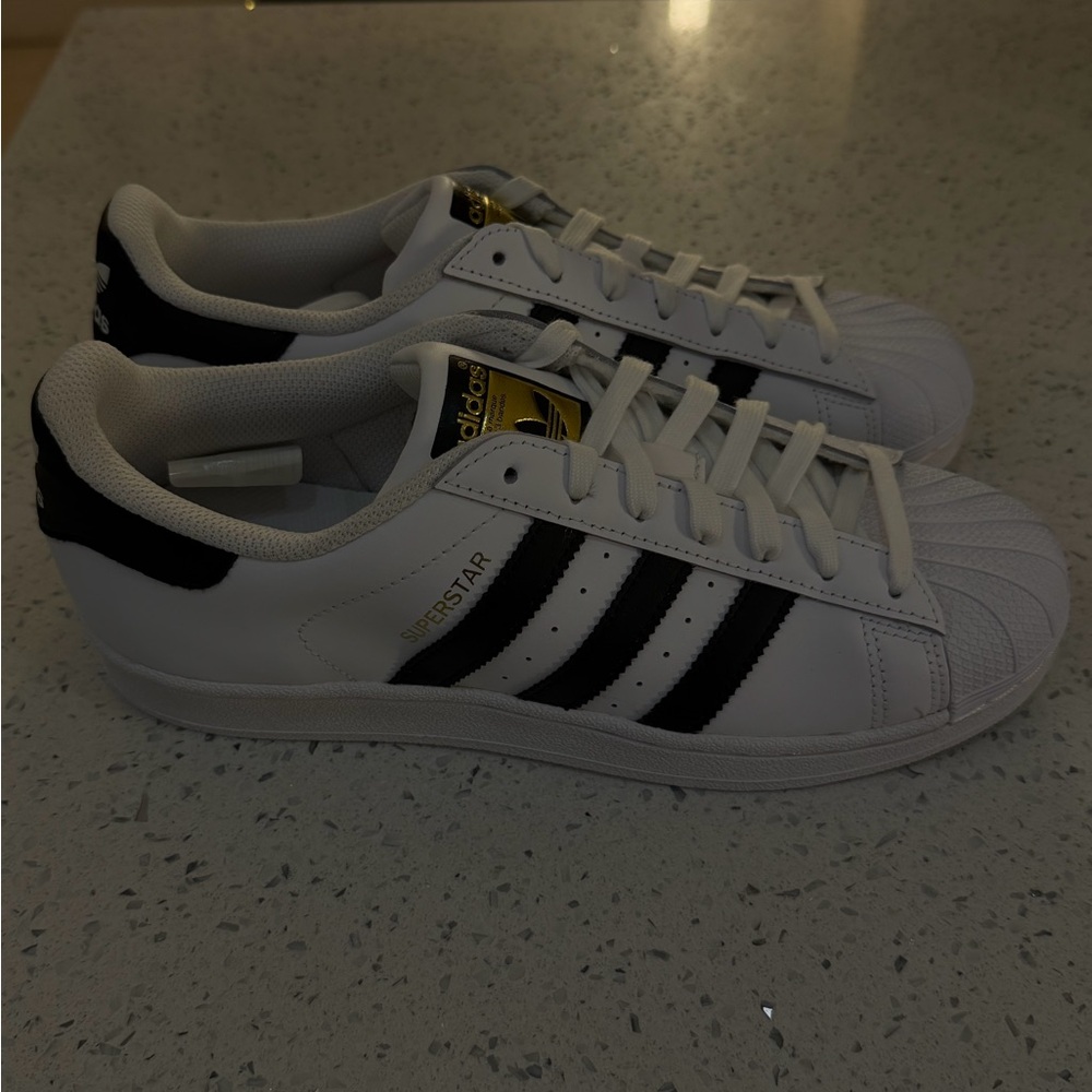 adidas Women’s White Sneakers with Black Stripes and Gold Tongue Logo - Picture 2 of 4